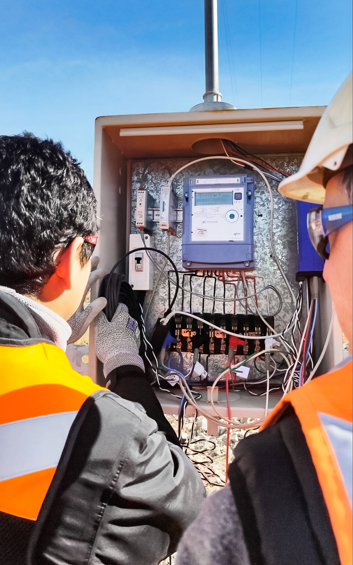Picture of staff installing data loggers on Cerro Pachón to aid the engineering design of the photovoltaic and battery system.