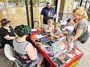 Family Visits NOIRLab Booth at AstroDay Kona 2024