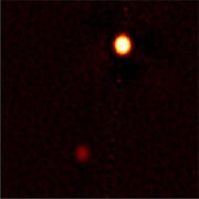 Sharpest-ever Ground-based Images of Pluto and Charon: Proves a Powerful Tool for Exoplanet Discoveries