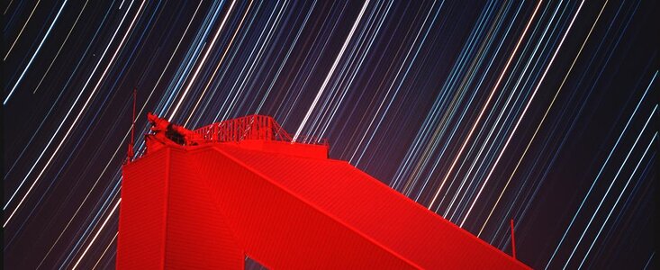 McMath Pierce Solar telescope at night with star trails