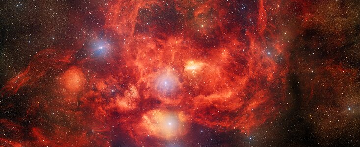 Dark Energy Camera Captures Bright, Young Stars Blazing Inside Glowing Nebula