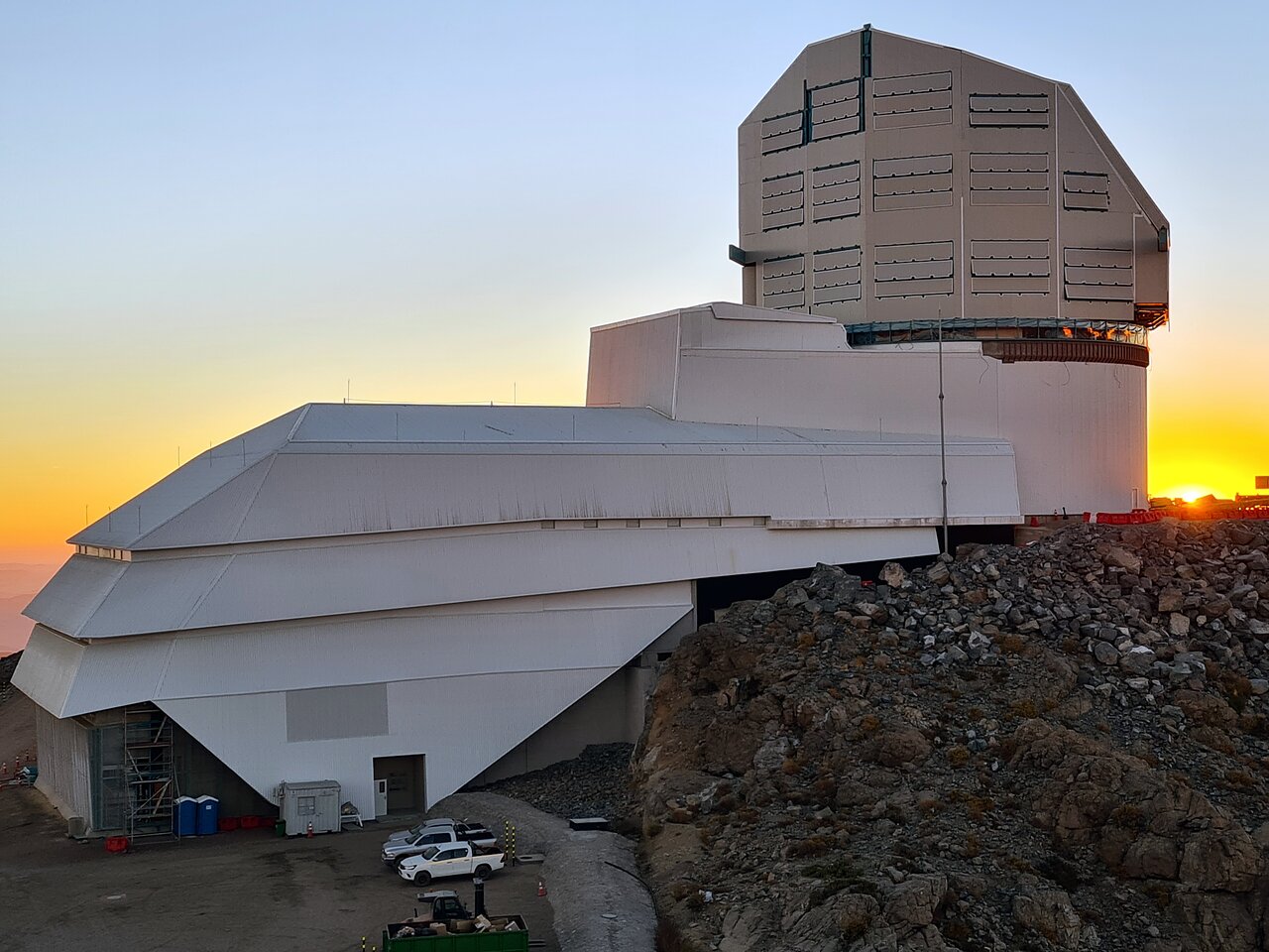 View of the Vera Rubin observatory dome in the sunset.