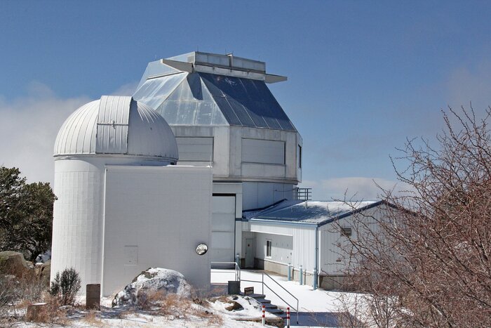The Visitor Center Levine 0.4-meter Telescope in front of the WIYN telescope