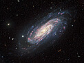 A Lonely Spiral in a Tapestry of Galaxies